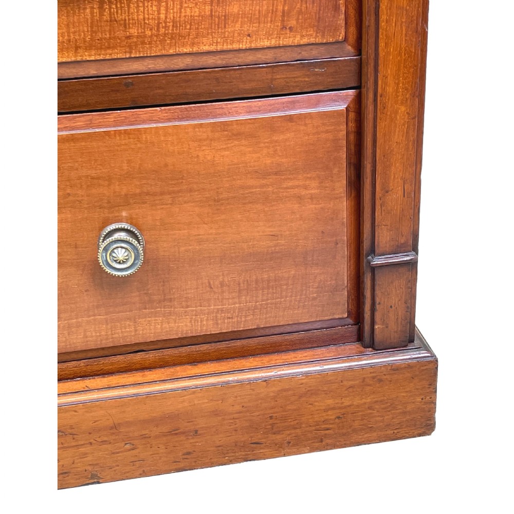 A tall Victorian mahogany double Wellington chest featuring twelve drawers arranged in two parallel columns with turned wooden knobs and side locking stiles. View V