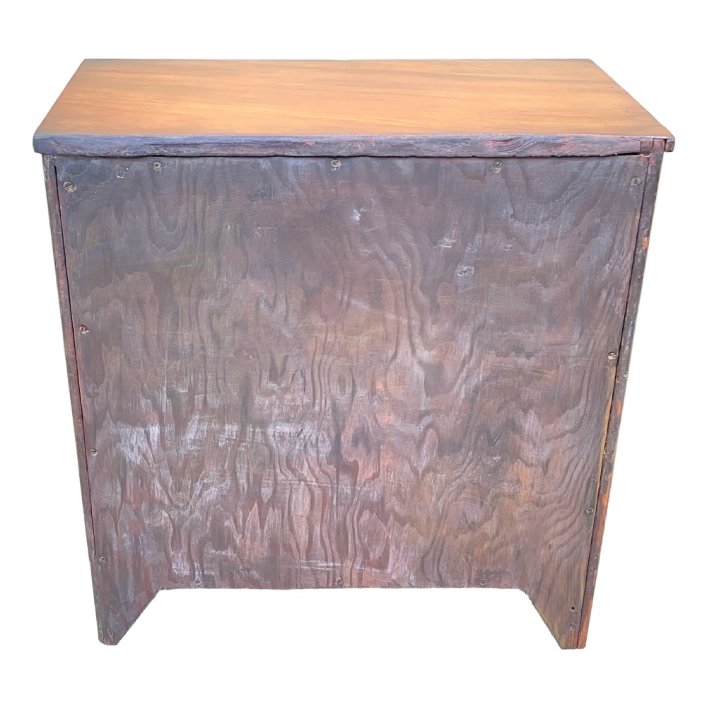 A Georgian mahogany miniature chest of drawers featuring four graduated drawers with ornate brass swan-neck handles and shaped bracket feet. View VI