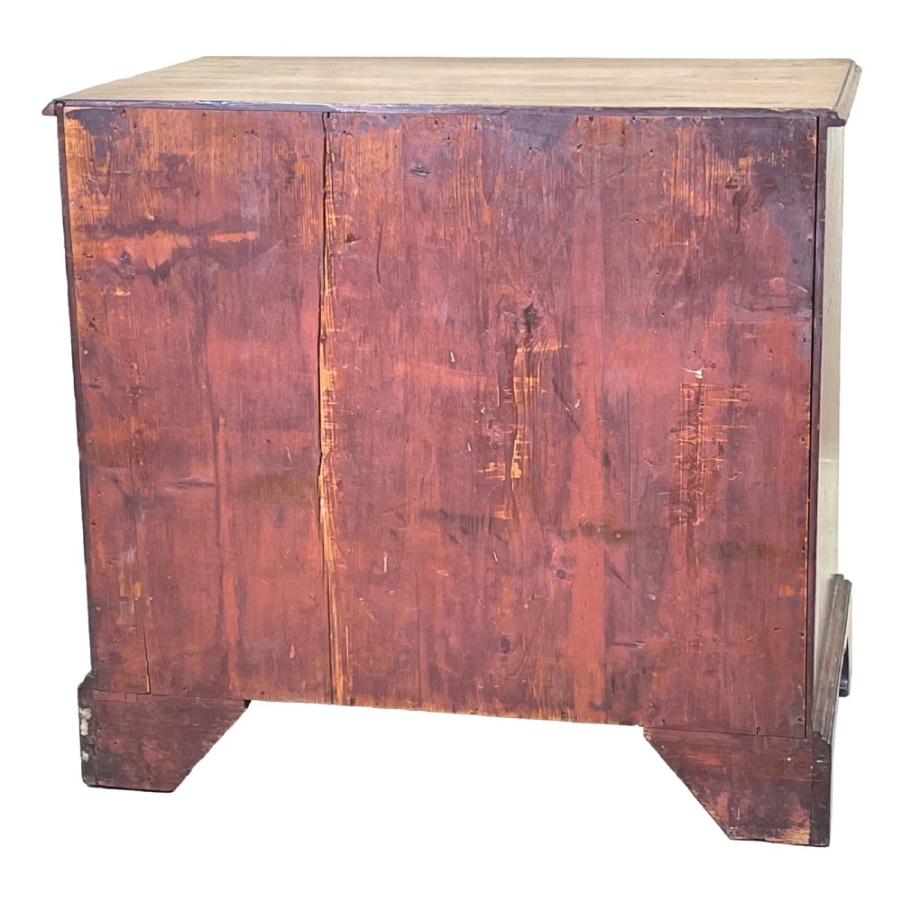An 18th-century Georgian mahogany chest of drawers featuring four graduated drawers with brass swan-neck handles, a pull-out brushing slide, and bracket feet. View V
