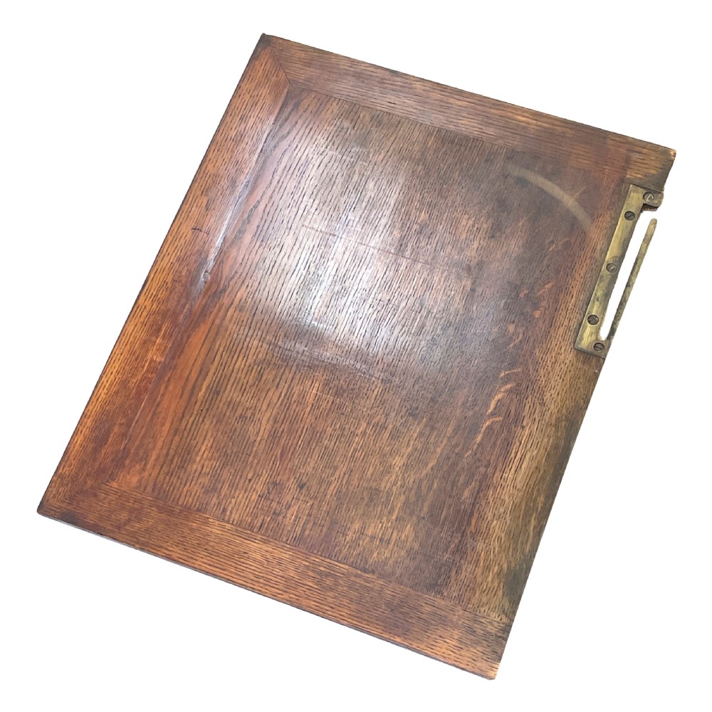 A Regency period burr elm Davenport desk featuring a sloped leather writing surface, a brass gallery railing, side drawers, bead moulding, and turned bun feet. View VIII