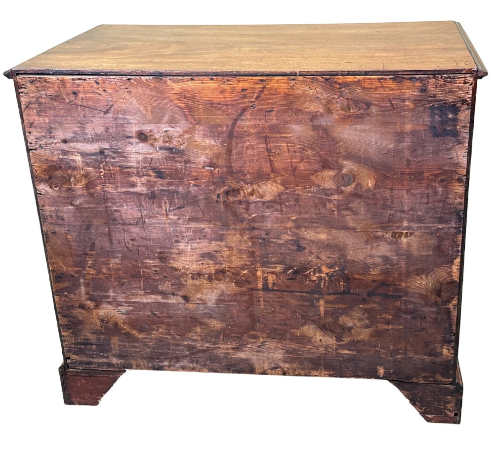 An 18th-century Georgian mahogany kneehole desk featuring brass swan-neck handles, a central recessed cupboard, a pull-out brushing slide, and bracket feet. View XI