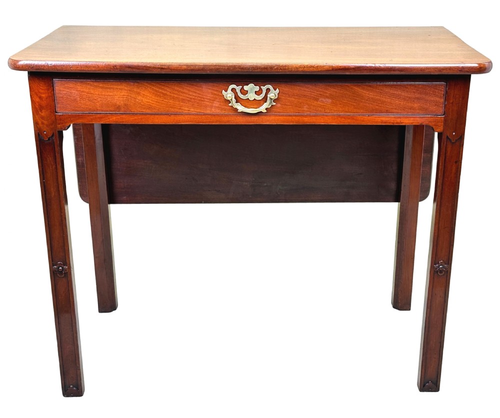 An 18th-century Georgian mahogany drop flap side table featuring a single drawer with a brass handle and carved square legs. View XIII