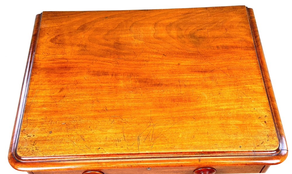 A 19th-century Victorian mahogany chest featuring five graduated drawers with turned wooden knobs and a solid plinth base. View V