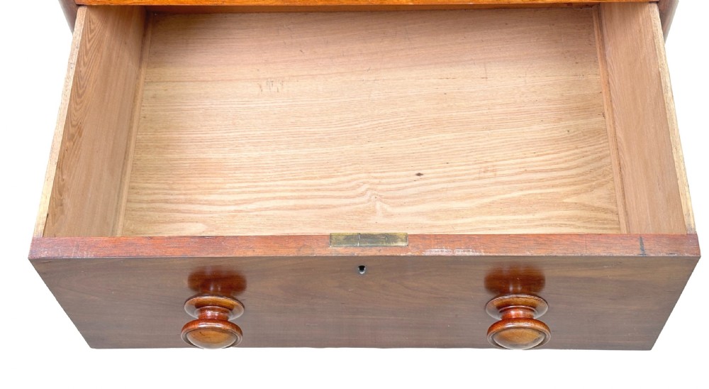 A 19th-century Victorian mahogany chest featuring five graduated drawers with turned wooden knobs and a solid plinth base. View VII