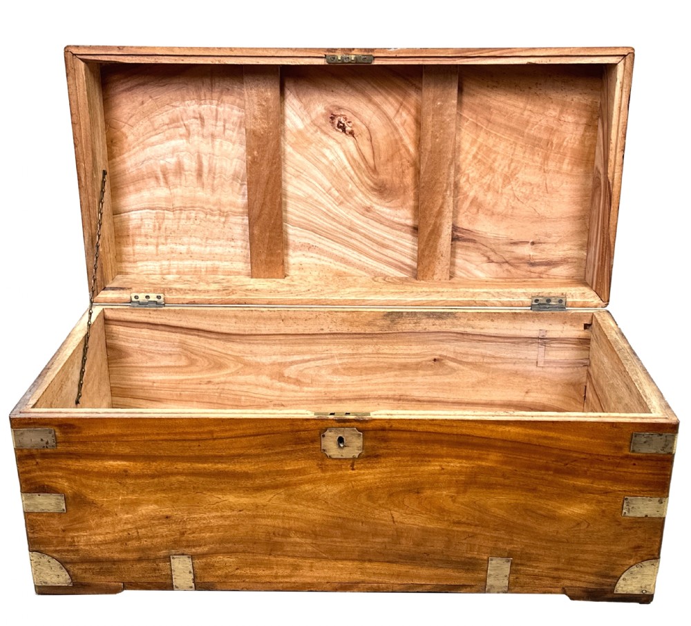 A 19th-century rectangular camphor wood campaign trunk featuring brass corner brackets, flush side handles, and a brass keyhole escutcheon. View V