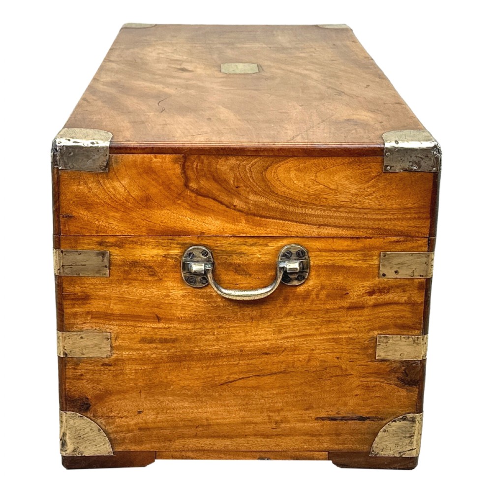 A 19th-century rectangular camphor wood campaign trunk featuring brass corner brackets, flush side handles, and a brass keyhole escutcheon. View VI