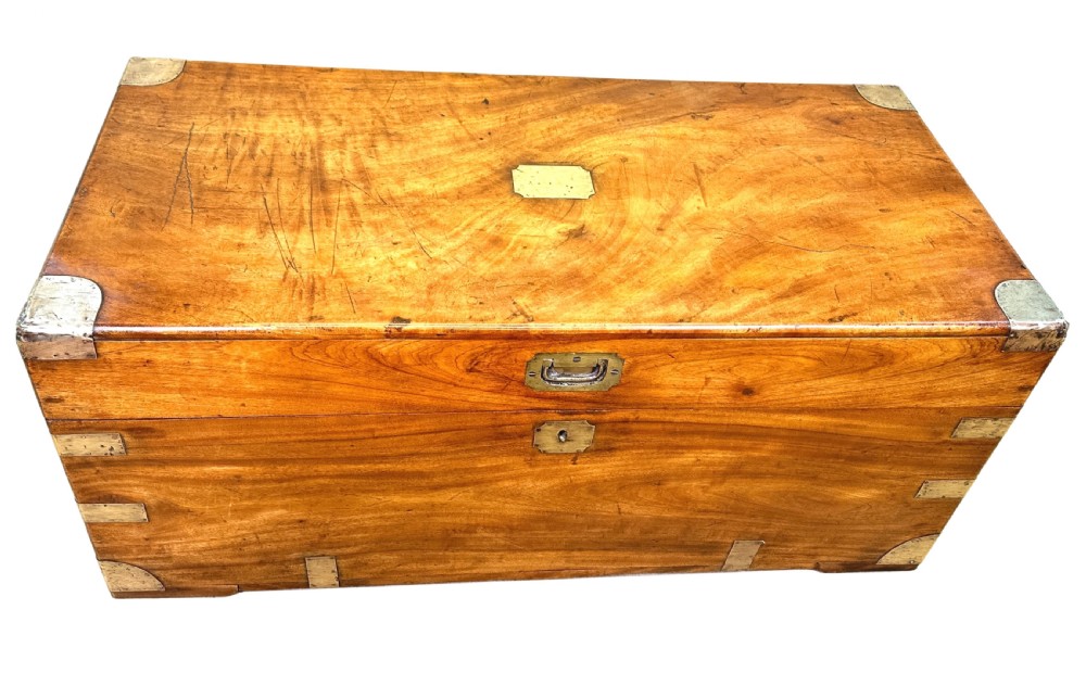 A 19th-century rectangular camphor wood campaign trunk featuring brass corner brackets, flush side handles, and a brass keyhole escutcheon. View VII