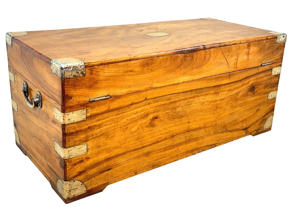 A 19th-century rectangular camphor wood campaign trunk featuring brass corner brackets, flush side handles, and a brass keyhole escutcheon. View X