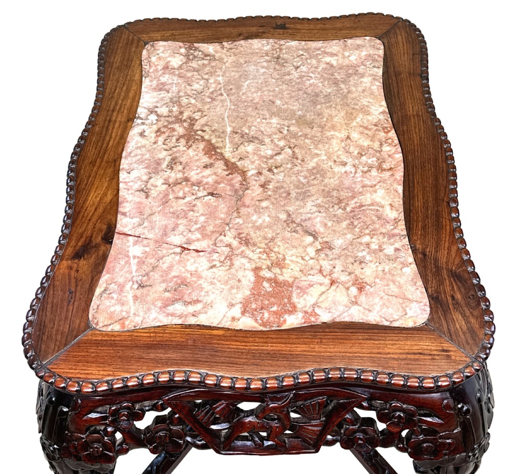 A 19th-century rectangular dark hardwood low table with an inset marble panel top, deeply carved floral apron, and cabriole legs. View VII