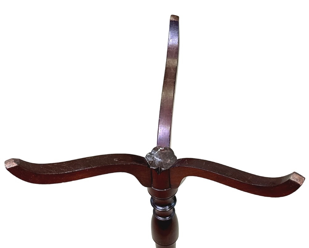 A tall George III mahogany torchere candle stand featuring a scalloped gallery top, turned column shaft, and splayed tripod legs. View VIII