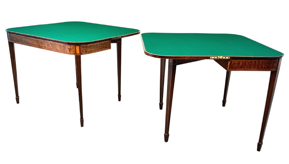 A pair of late Georgian mahogany fold-over card tables featuring satinwood crossbanding and square tapered legs. View VI