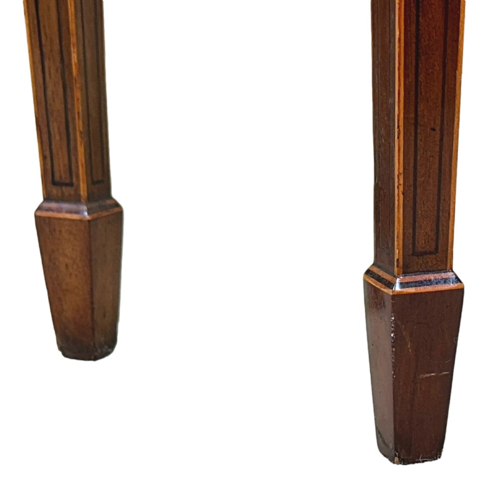 A pair of late Georgian mahogany fold-over card tables featuring satinwood crossbanding and square tapered legs. View IX