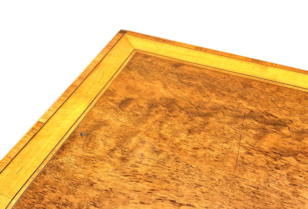 A pair of late Georgian mahogany fold-over card tables featuring satinwood crossbanding and square tapered legs. View XI