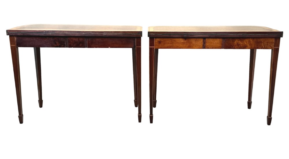 A pair of late Georgian mahogany fold-over card tables featuring satinwood crossbanding and square tapered legs. View XII