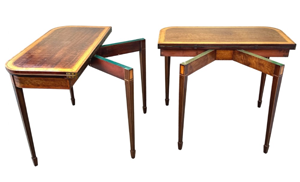 A pair of late Georgian mahogany fold-over card tables featuring satinwood crossbanding and square tapered legs. View XIII