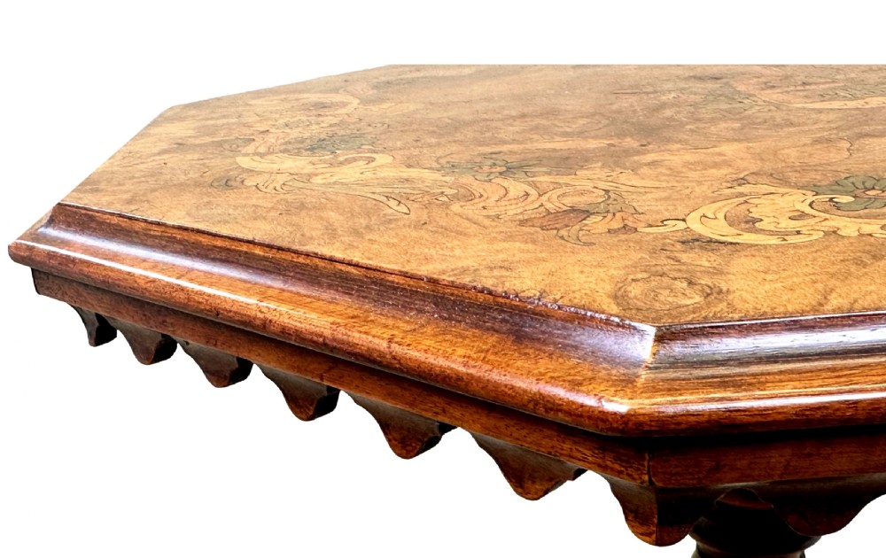 A Victorian walnut occasional table featuring an octagonal top, a barley twist central column, and carved tripod legs. View II