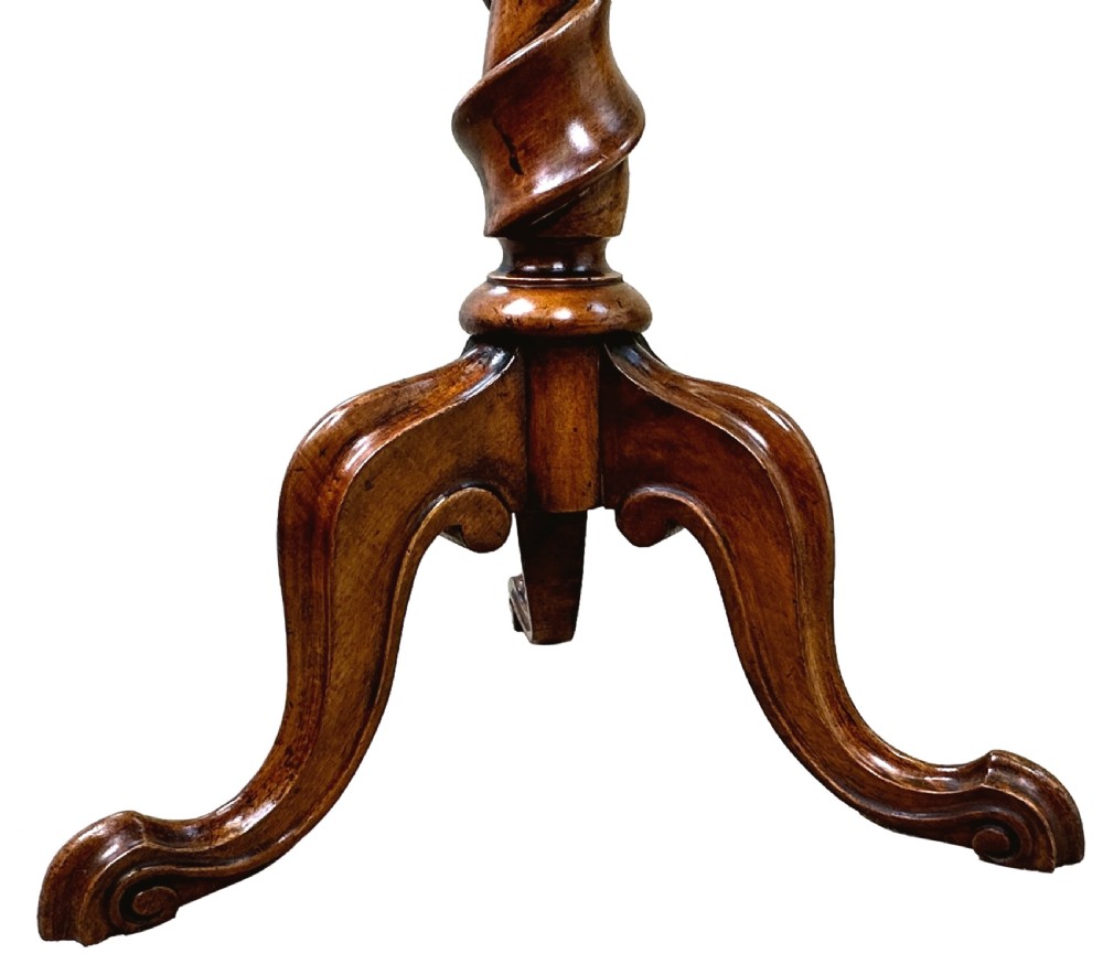 A Victorian walnut occasional table featuring an octagonal top, a barley twist central column, and carved tripod legs. View IV