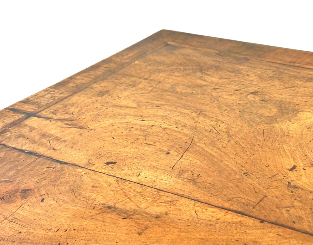 An 18th-century Georgian walnut lowboy table with three drawers, brass drop handles, a carved apron, and cabriole legs. View III