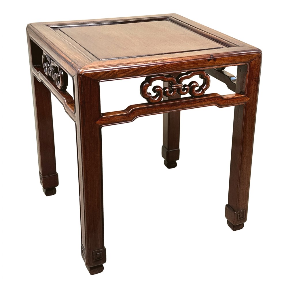 A dark brown square oriental hardwood side table featuring carved scrollwork aprons and straight legs with carved feet. View VI