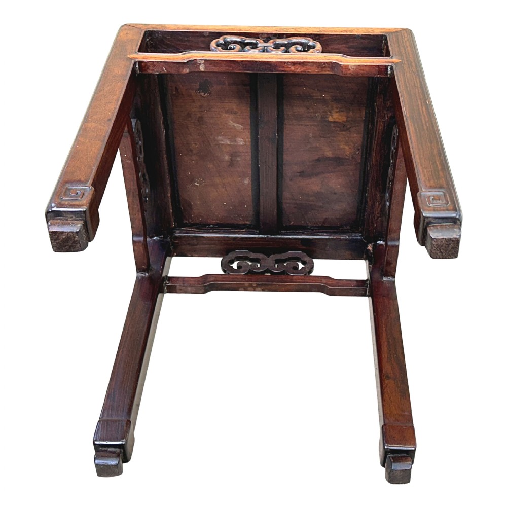 A dark brown square oriental hardwood side table featuring carved scrollwork aprons and straight legs with carved feet. View IX