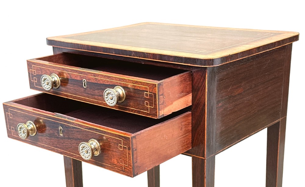 A tall Regency rosewood rectangular lamp table featuring two drawers with brass knobs, box stringing inlay, tapered legs, and brass castors. View II
