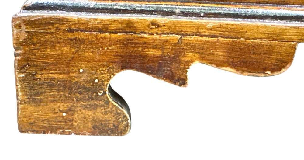 A 19th-century miniature pine chest of drawers with grain-painted finish, black line borders, and bracket feet. View V