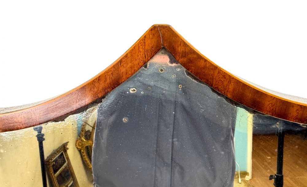 A Georgian mahogany dressing table mirror featuring a shield-shaped swivel mirror on shaped uprights above a serpentine base with two drawers. View XI
