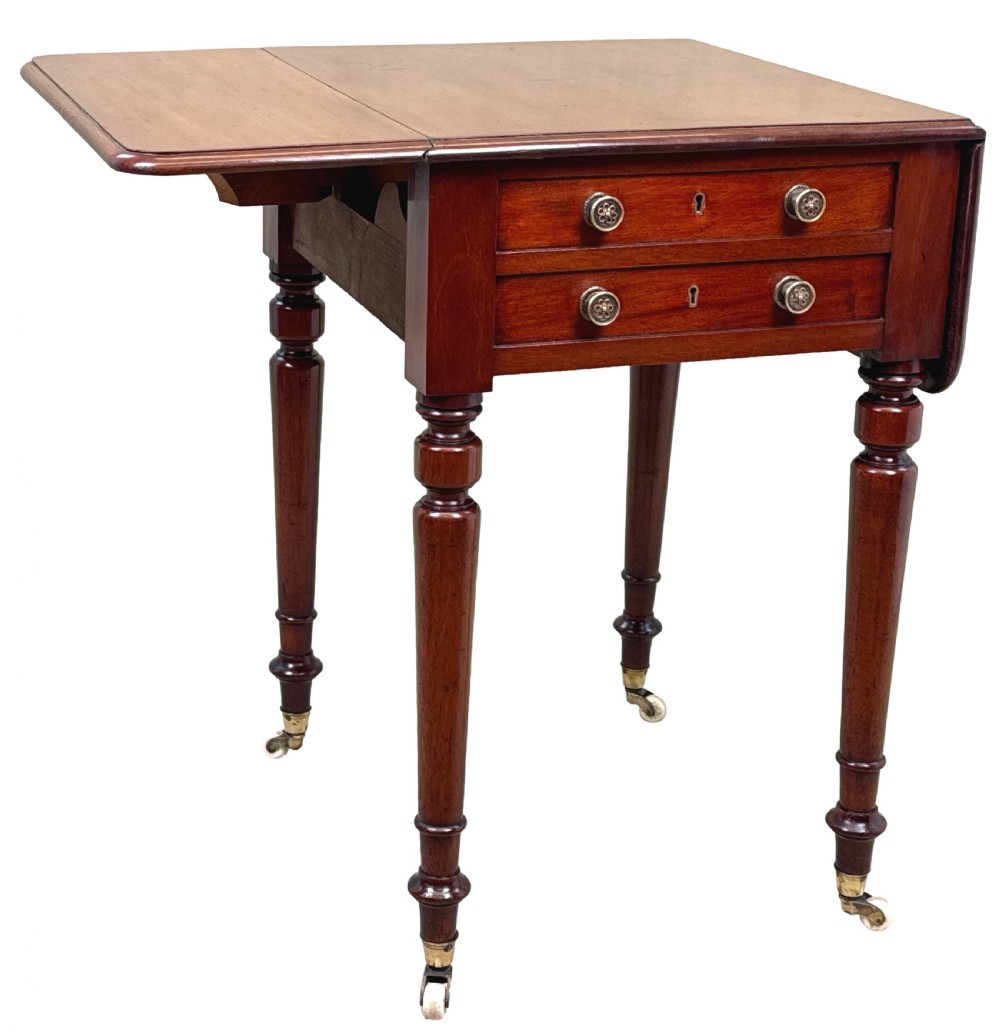 A nineteenth-century mahogany baby Pembroke table with two drawers, turned legs on brass castors, and drop-down side leaves. View VIII