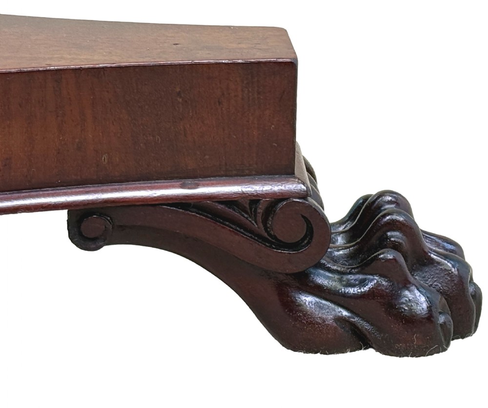A mid-19th century mahogany lamp table featuring an inlaid square chessboard on a round top, supported by a faceted pedestal and a tri-form base with carved feet. View III