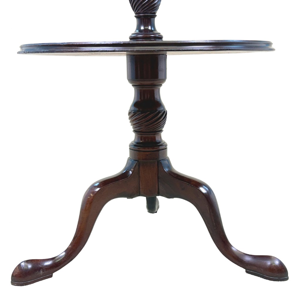 An 18th-century Georgian dark mahogany two-tier dumbwaiter featuring spiral turned details and a tripod base with cabriole legs. View III
