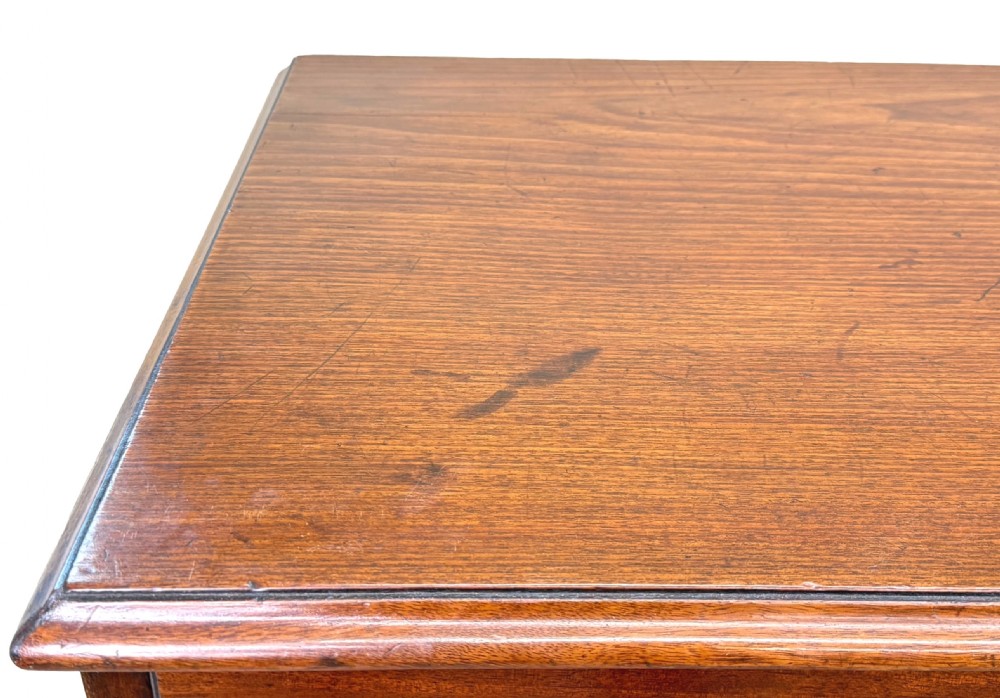 A George III mahogany chest of drawers featuring two short drawers over three long graduated drawers with brass swan-neck handles and bracket feet. View V