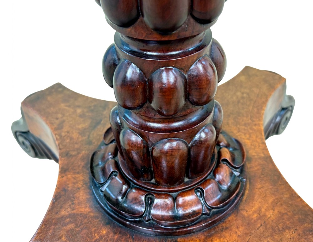 A nineteenth-century octagonal specimen wood occasional table featuring a geometric inlaid tabletop supported by a turned column and carved base. View II