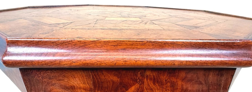 A nineteenth-century octagonal specimen wood occasional table featuring a geometric inlaid tabletop supported by a turned column and carved base. View IV