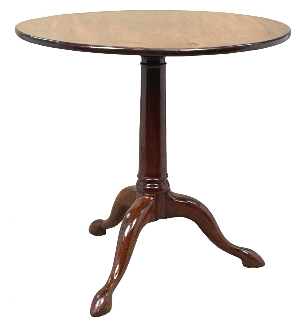 An 18th-century Georgian mahogany tripod table featuring a circular top supported by a central turned column and three splayed legs.