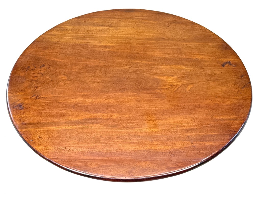 An 18th-century Georgian mahogany tripod table featuring a circular top supported by a central turned column and three splayed legs. View III