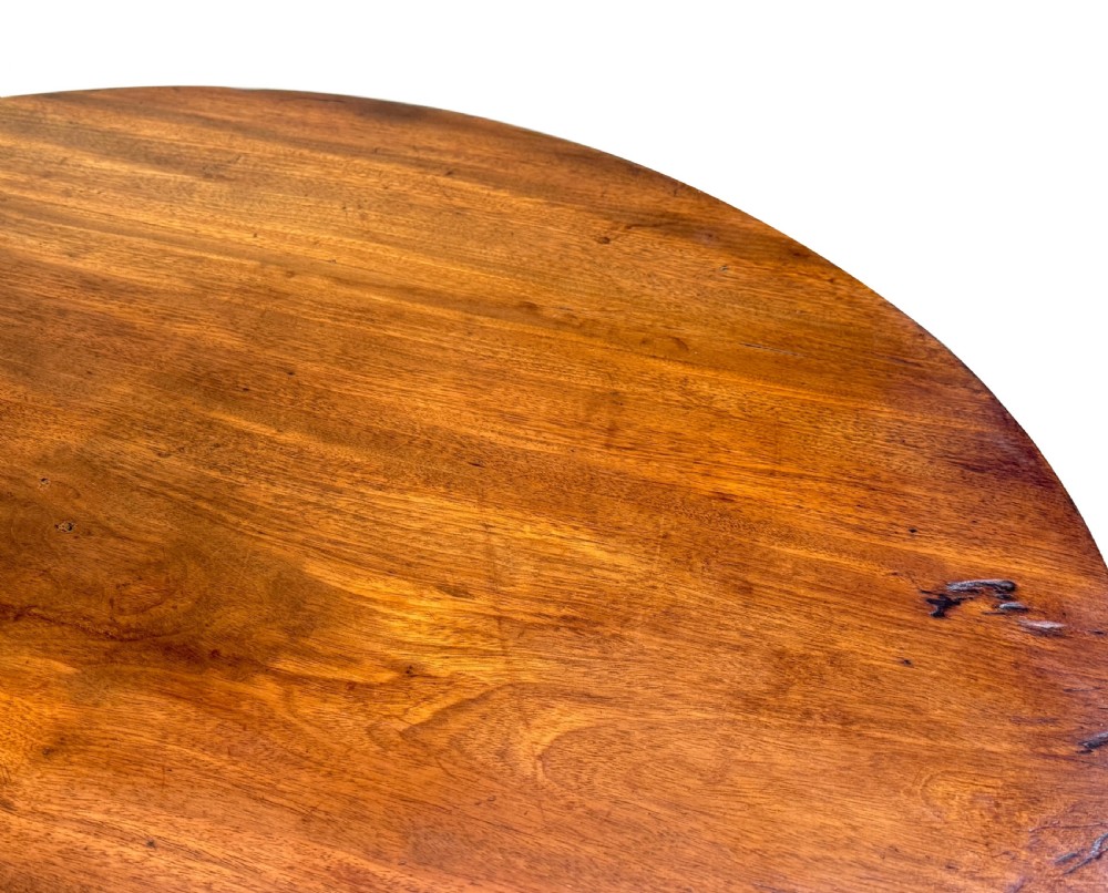 An 18th-century Georgian mahogany tripod table featuring a circular top supported by a central turned column and three splayed legs. View VIII