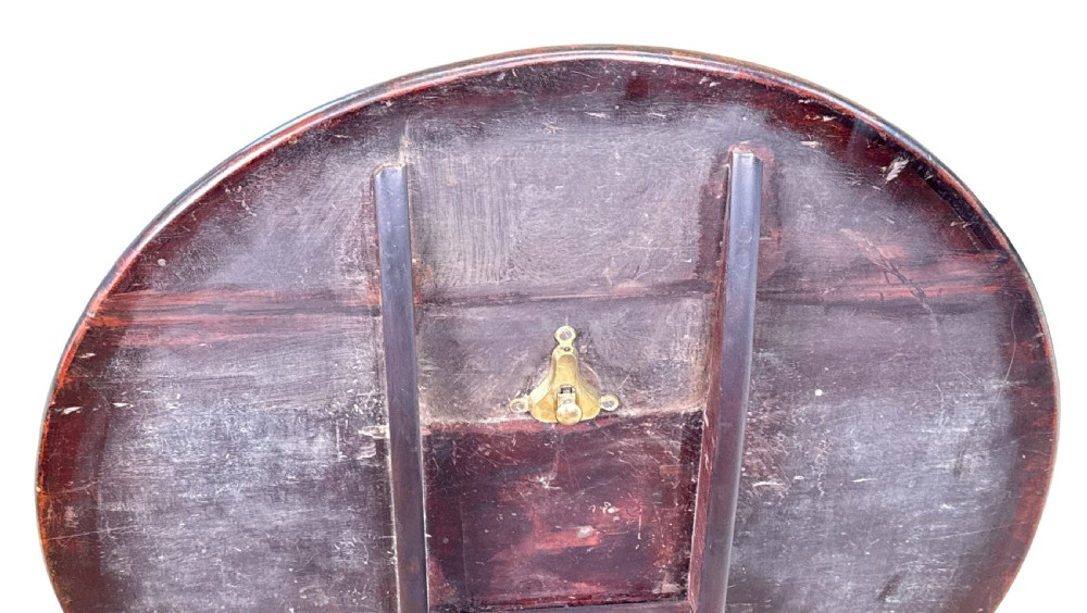 An 18th-century Georgian mahogany tripod table featuring a circular top supported by a central turned column and three splayed legs. View IX
