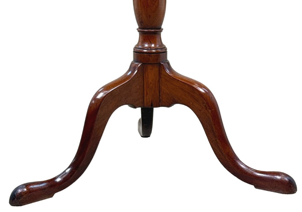 An 18th-century Georgian mahogany wine table featuring a smooth oval top, a turned central pedestal column, and tripod pad feet. View II