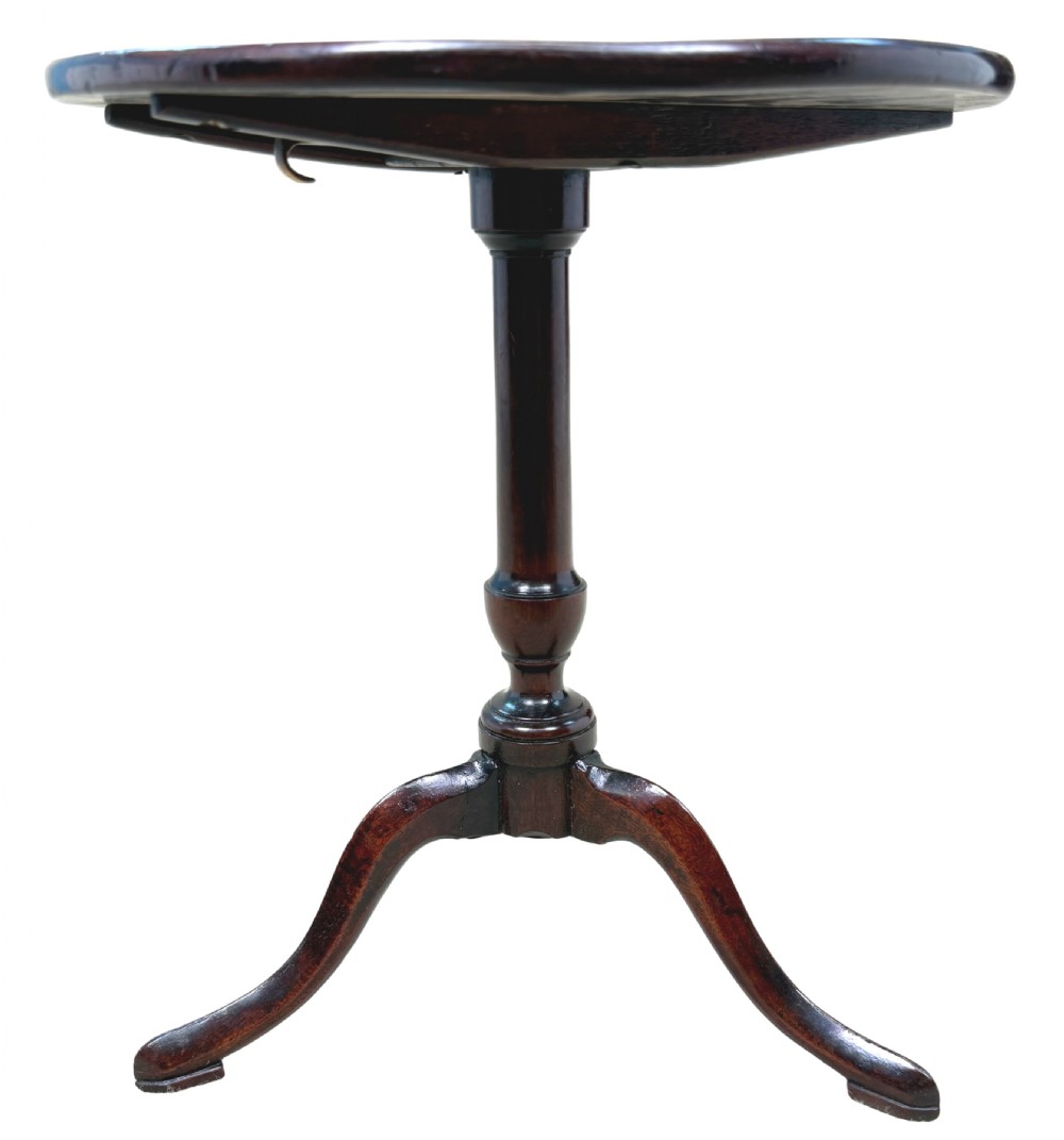 An 18th-century Georgian miniature mahogany tripod table featuring a round top, turned central stem, and three cabriole legs. View III