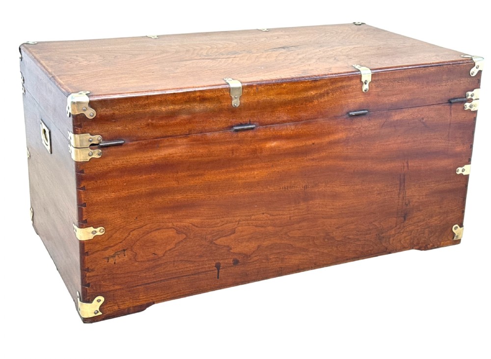 A large nineteenth-century camphor wood campaign trunk featuring brass corner mounts, heavy latches, and exposed dovetail joints. View XIII