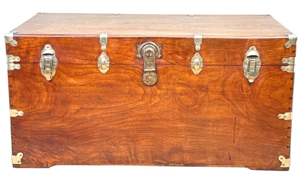 A large nineteenth-century camphor wood campaign trunk featuring brass corner mounts, heavy latches, and exposed dovetail joints. View XV