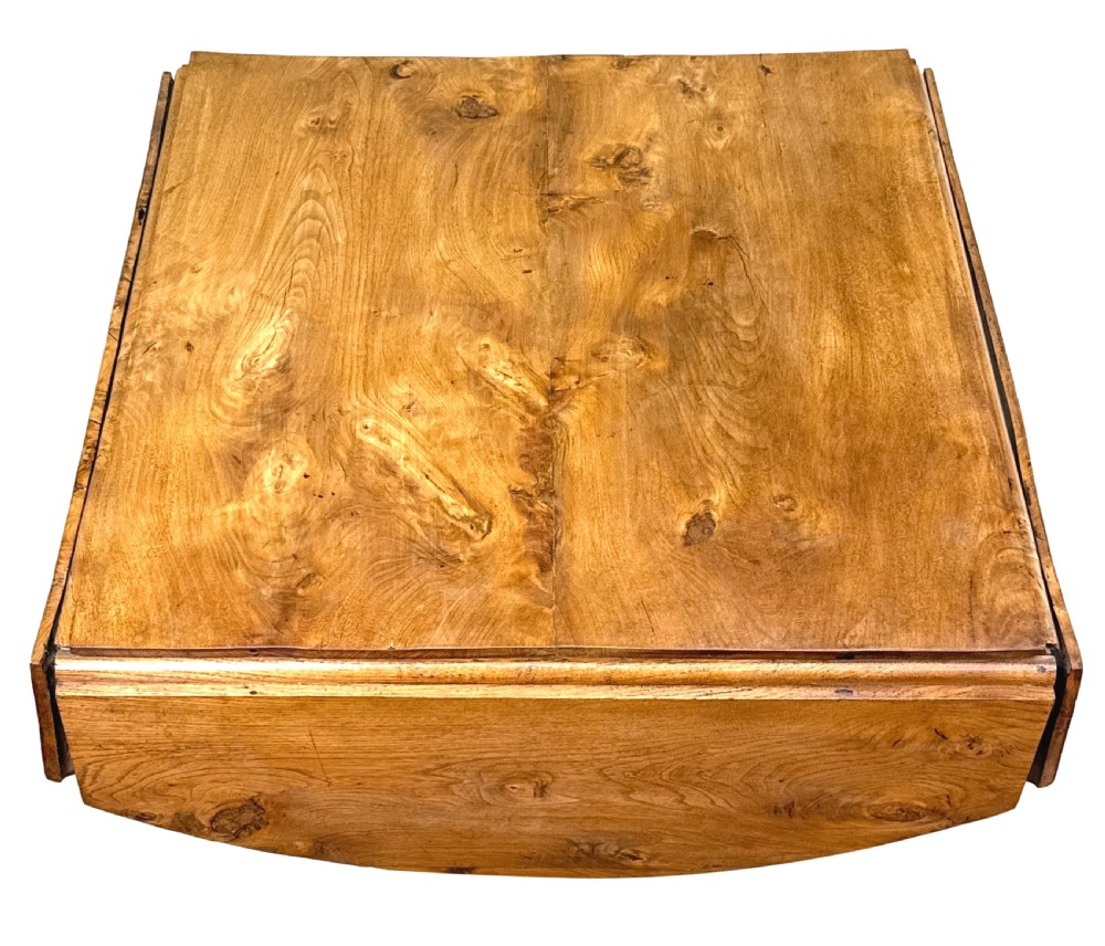 A nineteenth-century French Provincial elm centre table featuring a round top with two drop leaves, a turned central pedestal, and a three-legged tripod base. View XI