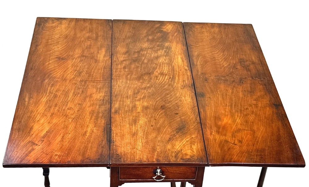 An 18th-century mahogany spider leg table featuring drop leaves, a single frieze drawer with a brass ring handle, and slender turned legs connected by stretchers. View II