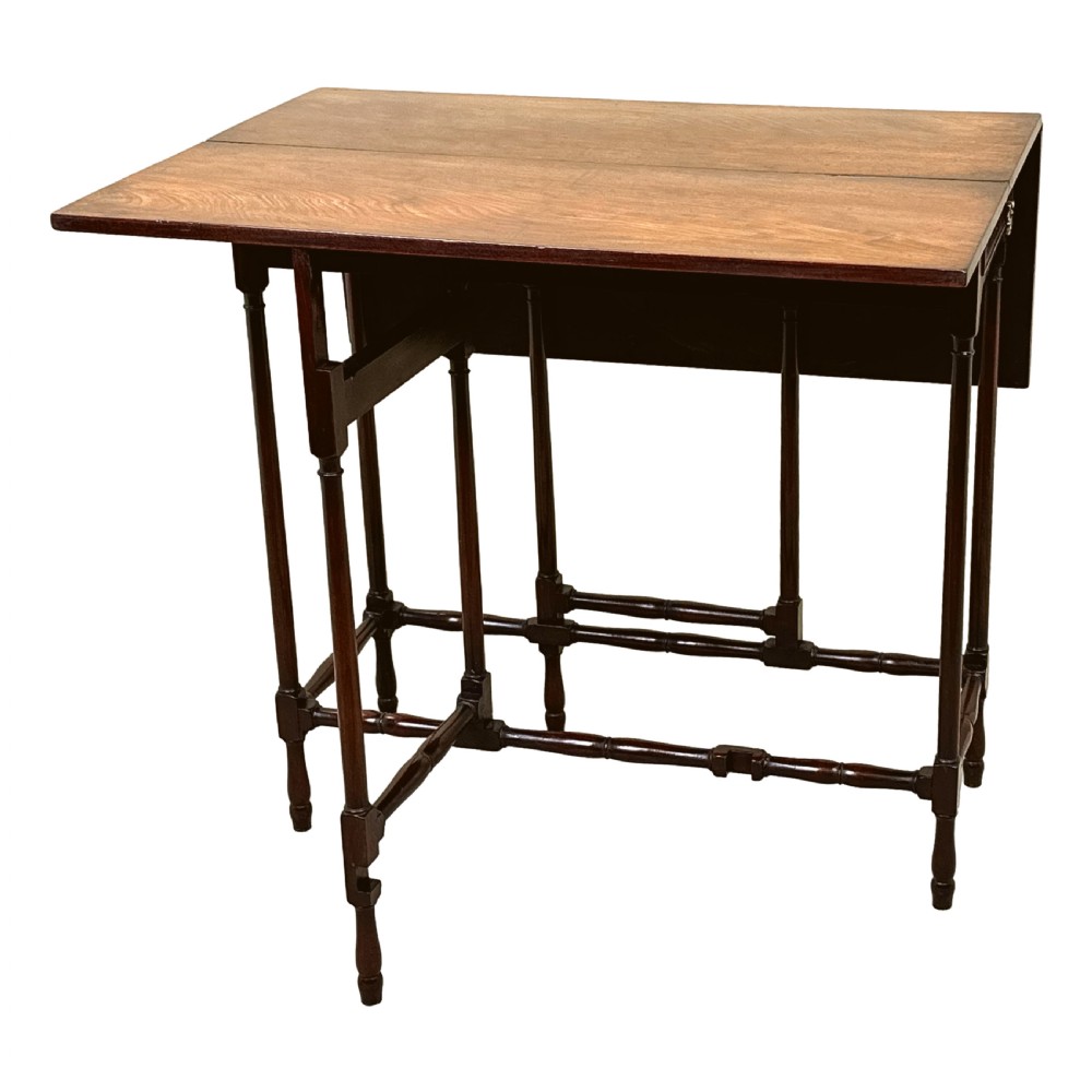 An 18th-century mahogany spider leg table featuring drop leaves, a single frieze drawer with a brass ring handle, and slender turned legs connected by stretchers. View III