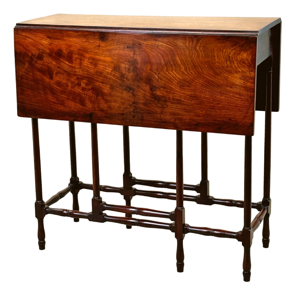 An 18th-century mahogany spider leg table featuring drop leaves, a single frieze drawer with a brass ring handle, and slender turned legs connected by stretchers. View VI