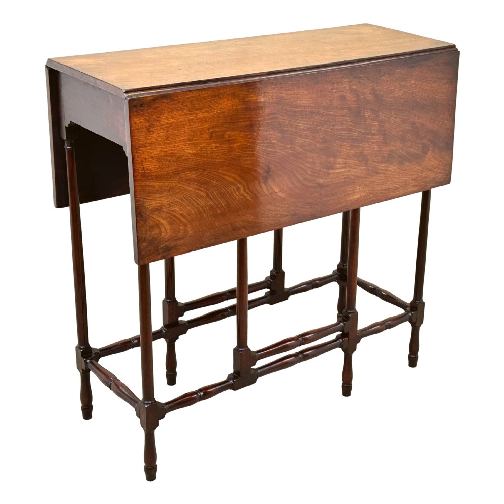 An 18th-century mahogany spider leg table featuring drop leaves, a single frieze drawer with a brass ring handle, and slender turned legs connected by stretchers. View IX