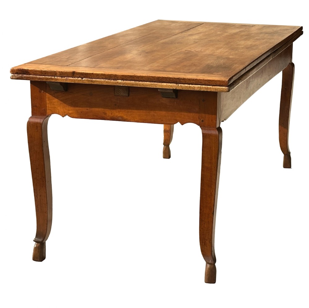 An early 19th-century warm brown extending farmhouse dining table with two end pull-out extensions supported by additional legs. View XV