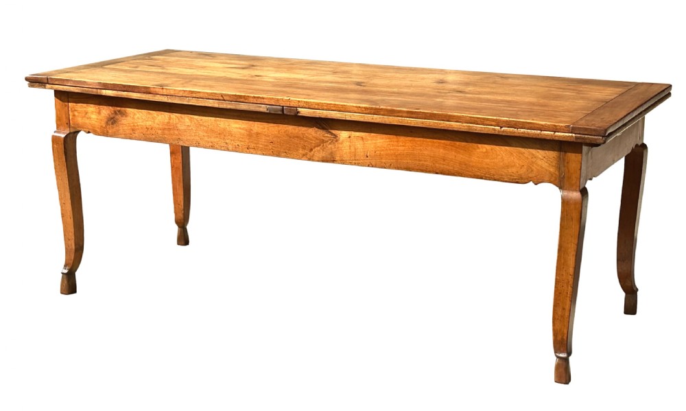 An early 19th-century warm brown extending farmhouse dining table with two end pull-out extensions supported by additional legs. View XXI