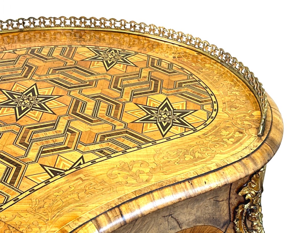 A 19th-century kidney-shaped burr walnut table featuring marquetry inlay, cabriole legs, and brass ormolu mounts with a pierced gallery edge. View II