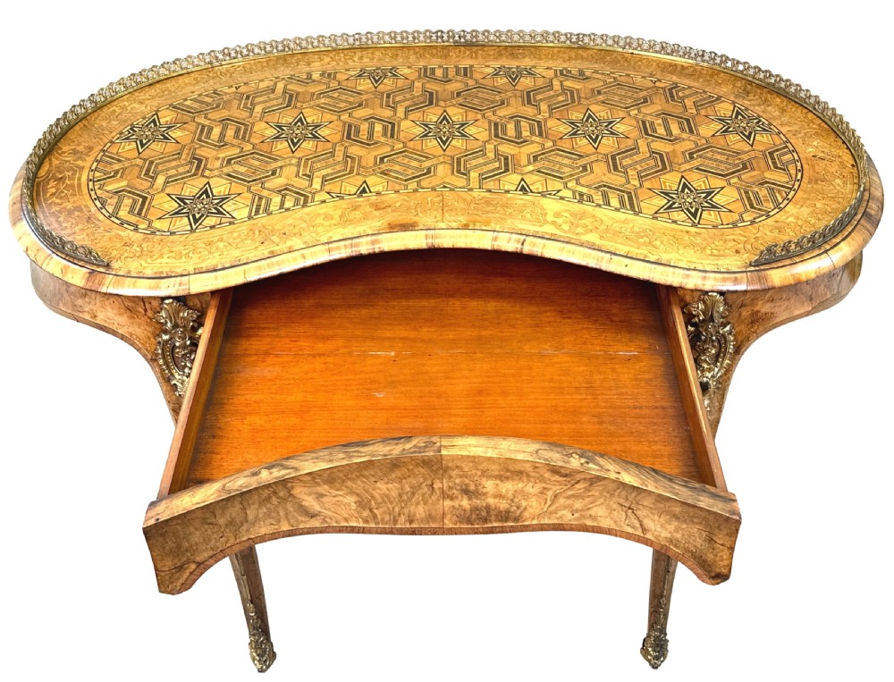 A 19th-century kidney-shaped burr walnut table featuring marquetry inlay, cabriole legs, and brass ormolu mounts with a pierced gallery edge. View III